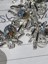 12mm metal spider and gem four hole bead.