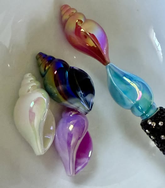 36mm glossy shell that fits pens. Random color pick only