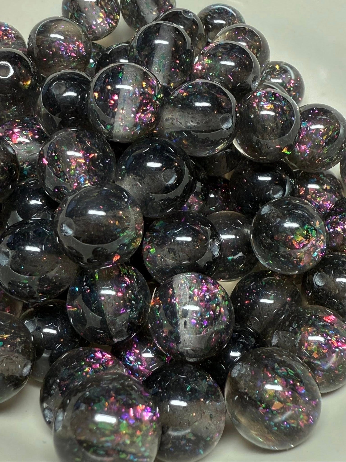16mm drop dead gorgeous smoky black with a rainbow of glitter inside beads