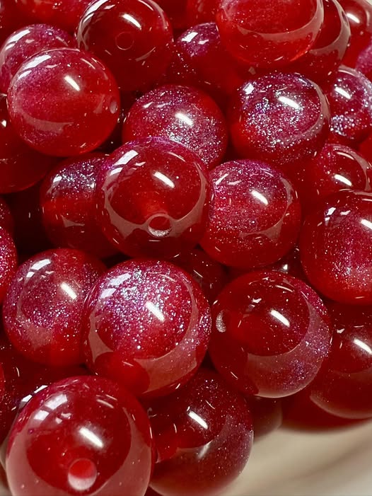 16mm cranberry red with blue galaxy resin bead