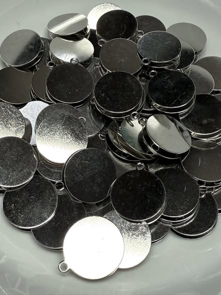 12mm double sided flat metal bead with hoop for a pendant charm.