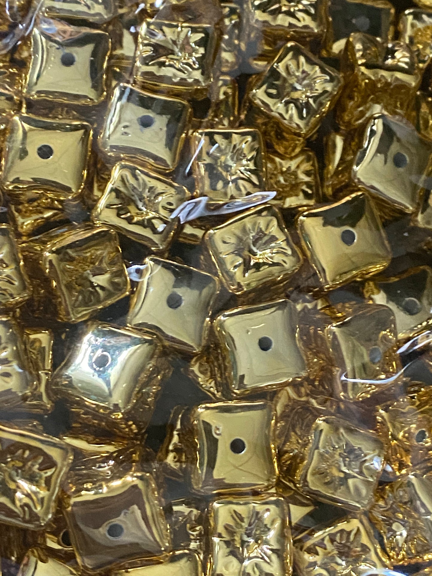 Metallic gold indented cube