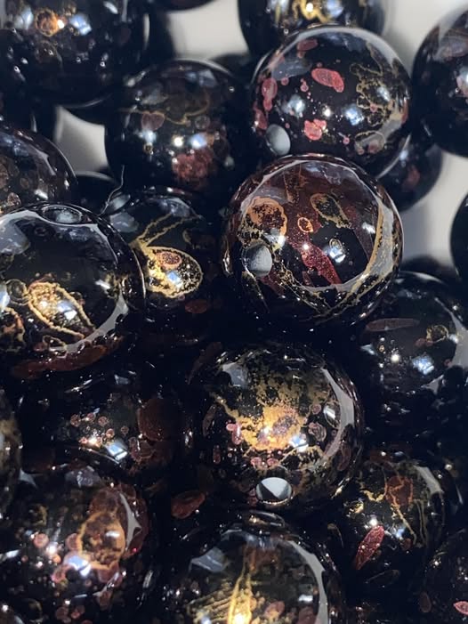 16mm UV Black bead with glossy splashes of alcohol ink in red and gold