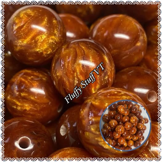 16mm out of this world cats eye. These are a brown leather color with a fire burning depth of color.