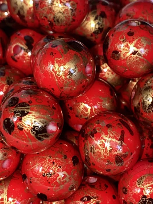 16mm red bead with gold and black alcohol ink