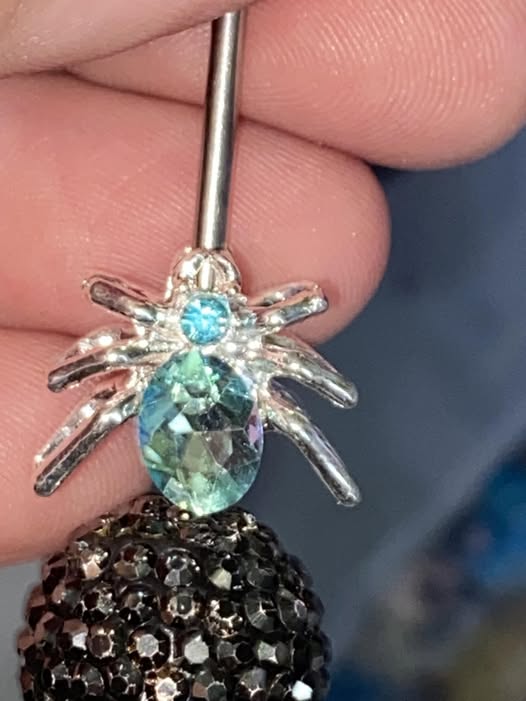12mm metal spider and gem four hole bead.