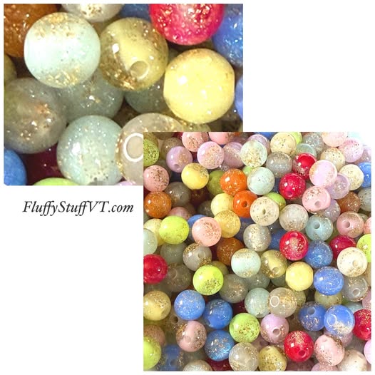 10mm gold glitter galaxy bead.