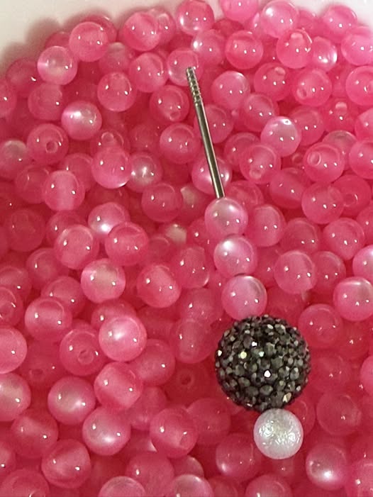 8mm dark pink cats eye beads.