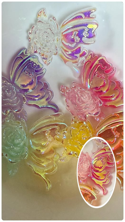 5cm you have got to be kidding me with this flat back charm! The glowing iridescent rose with a butterfly.