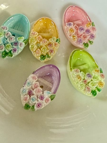 Pretty little glossy flower boat bead. It has an open top to hold a small character bead. 10mm