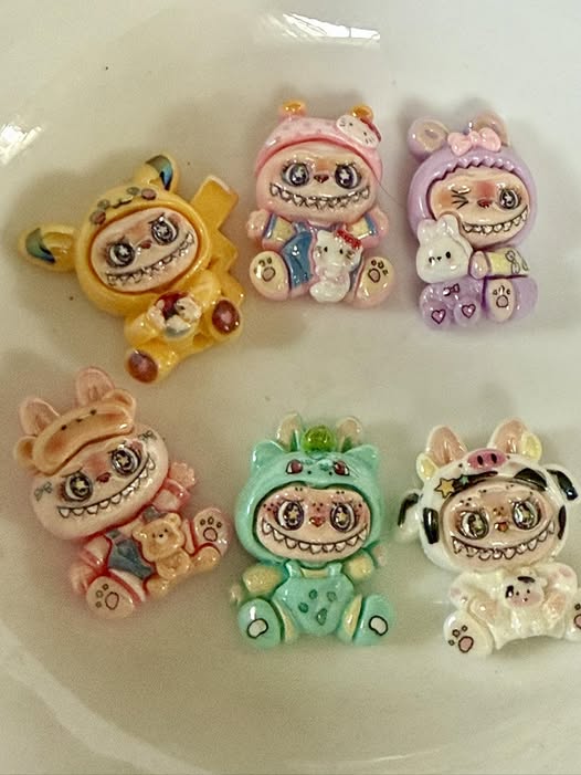 28mm Labubu flat back beads with a glossy coating these fit pens.