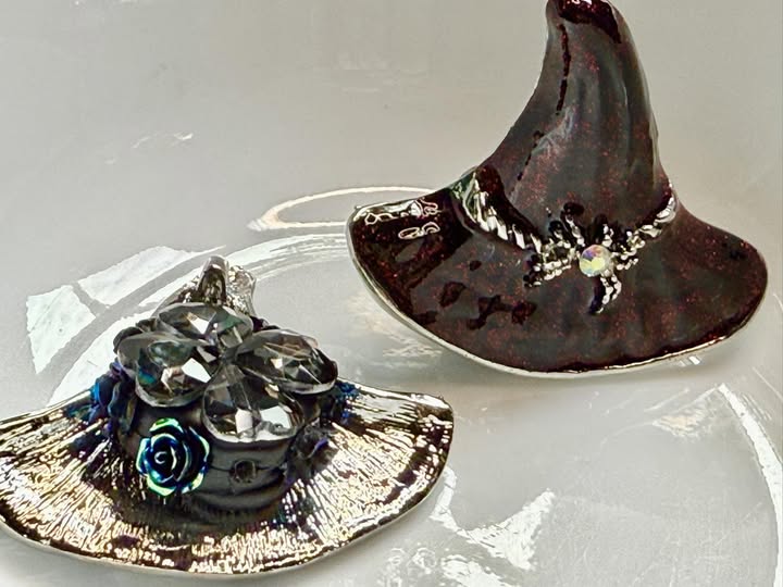 55mm black with crimson glitter witches hat with a rhinestone spider.