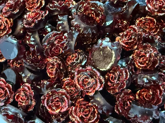 1cm flat back red rose with black base.