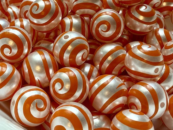 16mm swirl beads  with a shiny uv coating