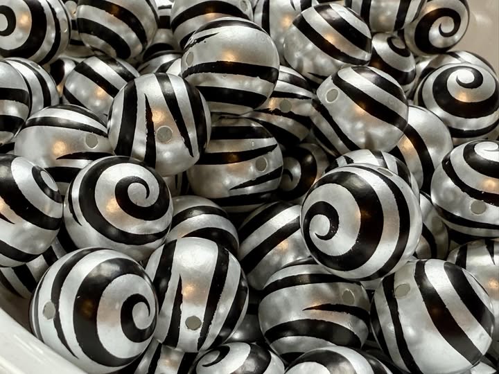 16mm swirl beads  with a shiny uv coating