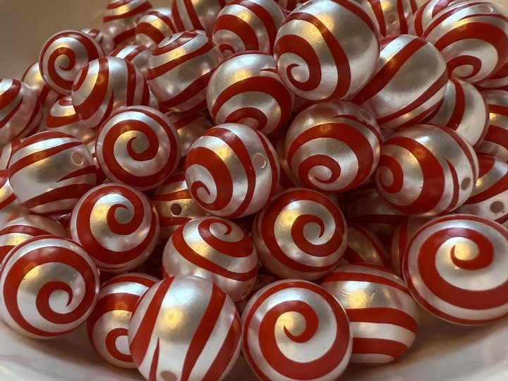16mm swirl beads  with a shiny uv coating