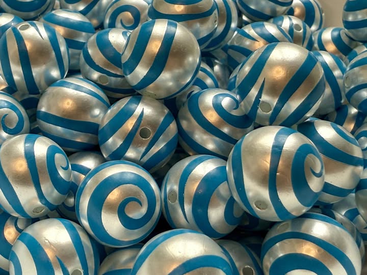 16mm swirl beads  with a shiny uv coating