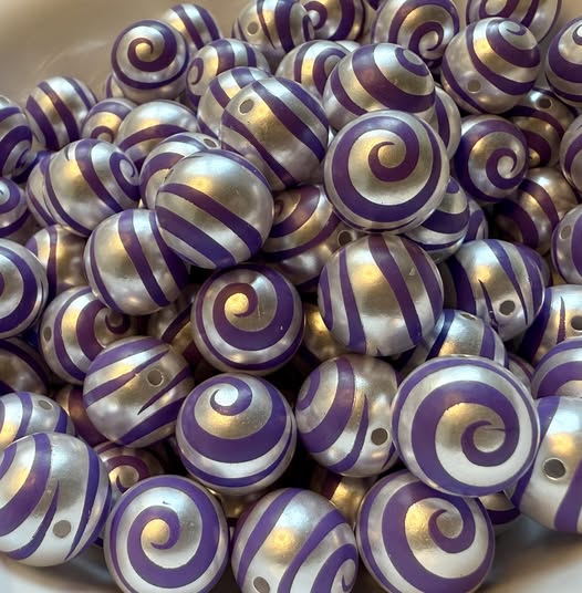 16mm swirl beads  with a shiny uv coating