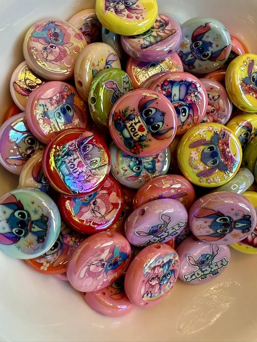 24mm flat round colorful Stitch beads fits pens and cute as all heck.