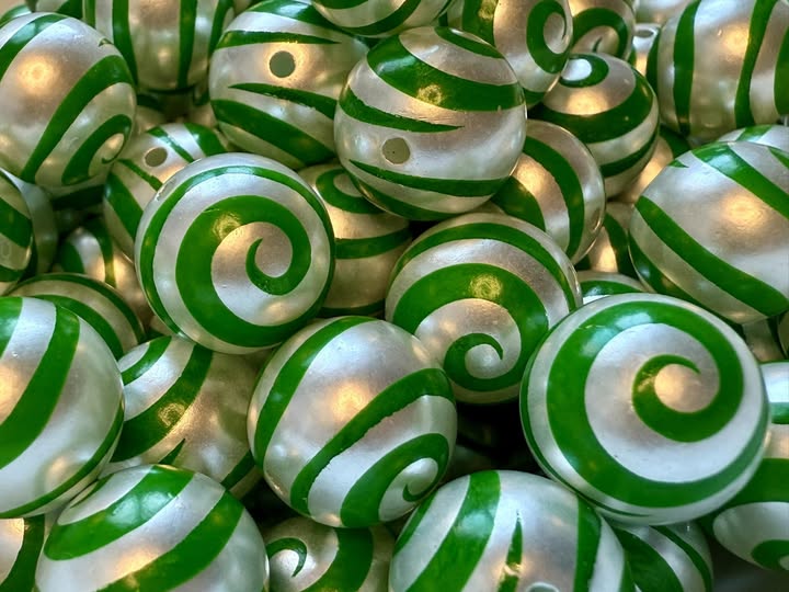 16mm swirl beads  with a shiny uv coating