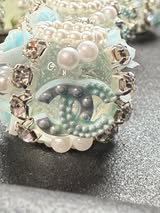 High end hand made designer CC with rhinestone, flower, and pearl beads.
