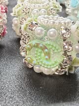 High end hand made designer CC with rhinestone, flower, and pearl beads.