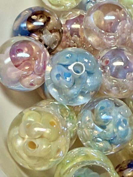 16mm resin bead filled with pearl seed beads with a big end silver uv coating