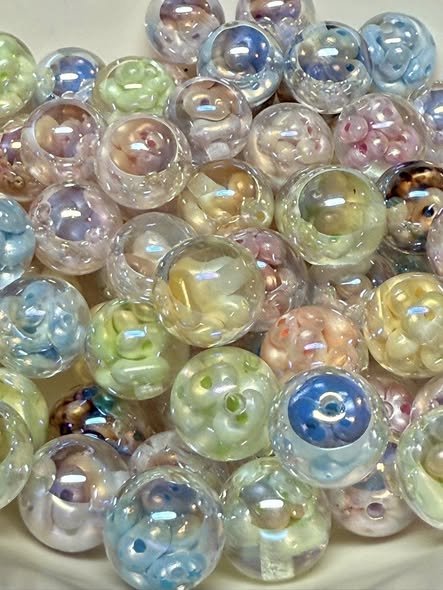 16mm resin bead filled with pearl seed beads with a big end silver uv coating