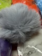 2.5” fluffy pompom with chain and lobster claw hardware.