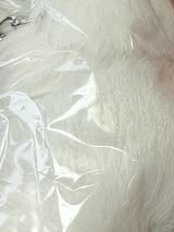 2.5” fluffy pompom with chain and lobster claw hardware.