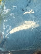 2.5” fluffy pompom with chain and lobster claw hardware.