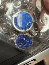 Retractable metal beadable badge reel with holographic glitter.