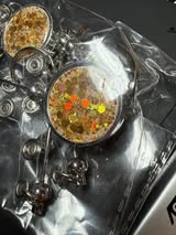 Retractable metal beadable badge reel with holographic glitter.