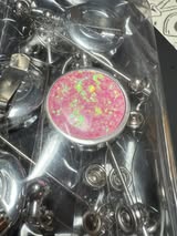 Retractable metal beadable badge reel with holographic glitter.