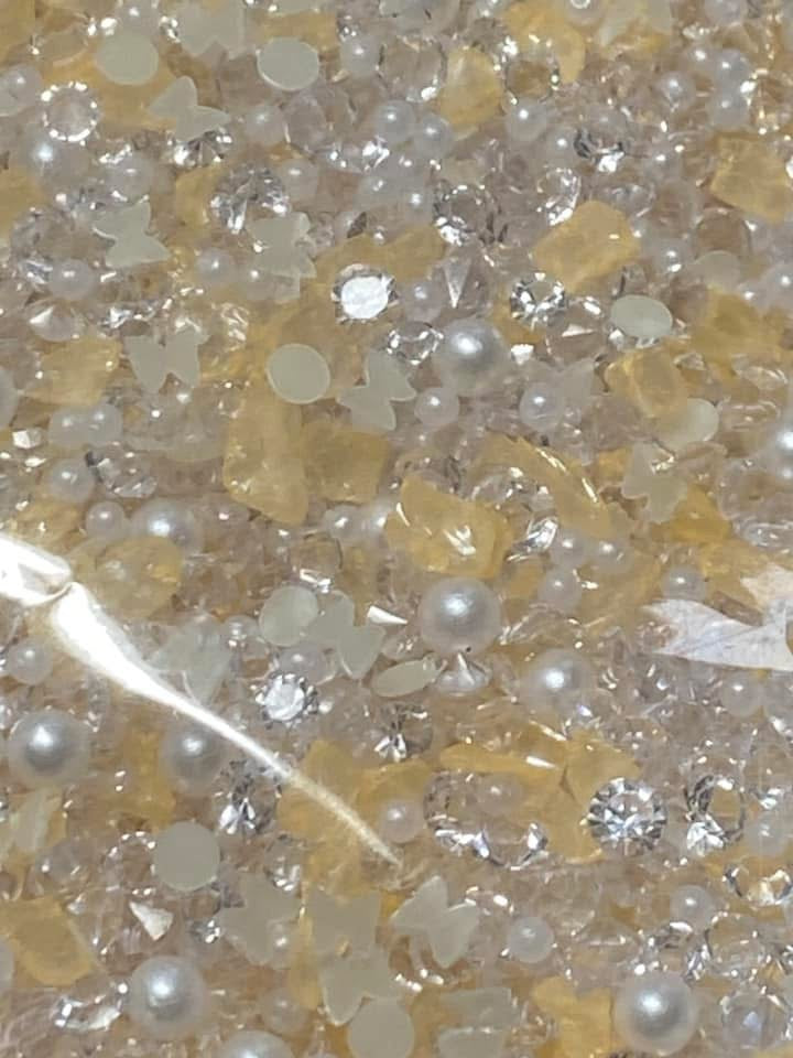 Acrylic sugar crystals for decorating your own pens,fancy beads, journal pages. Hair bands and so much more. Try using it on a bookmark!