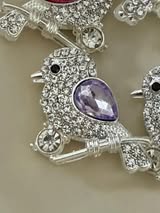 24mm metal bird bead with clear rhinestones and colored gem.