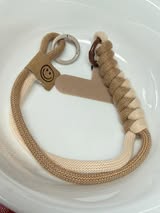 Rope phone wristlet with spring clips and a phone tab