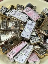 Gold chrome HK bead or pendant Apple cell phone some designs are LV