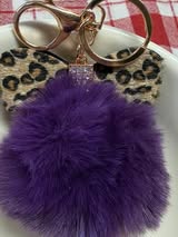3" Fuffy pompom with chain and lobster claw hardware.