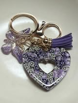 Resin filled heart shaped pendant with all gold hardware, an adorable little tassel and finally a stunning butterfly