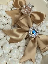 60mm satin bow with large gem heart a sugar bead with a stunning crown.