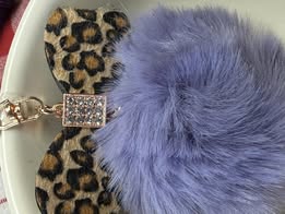 3" Fuffy pompom with chain and lobster claw hardware.