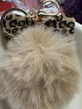 3" Fuffy pompom with chain and lobster claw hardware.
