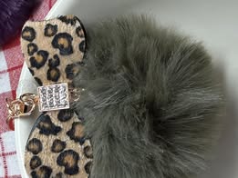 3" Fuffy pompom with chain and lobster claw hardware.