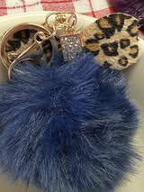 3" Fuffy pompom with chain and lobster claw hardware.