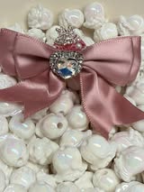 60mm satin bow with large gem heart a sugar bead with a stunning crown.
