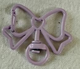 Bow shaped spring clip with swivel bottom
