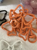 Bow shaped spring clip with swivel bottom