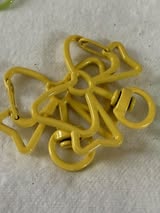 Bow shaped spring clip with swivel bottom