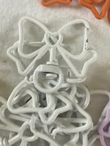 Bow shaped spring clip with swivel bottom